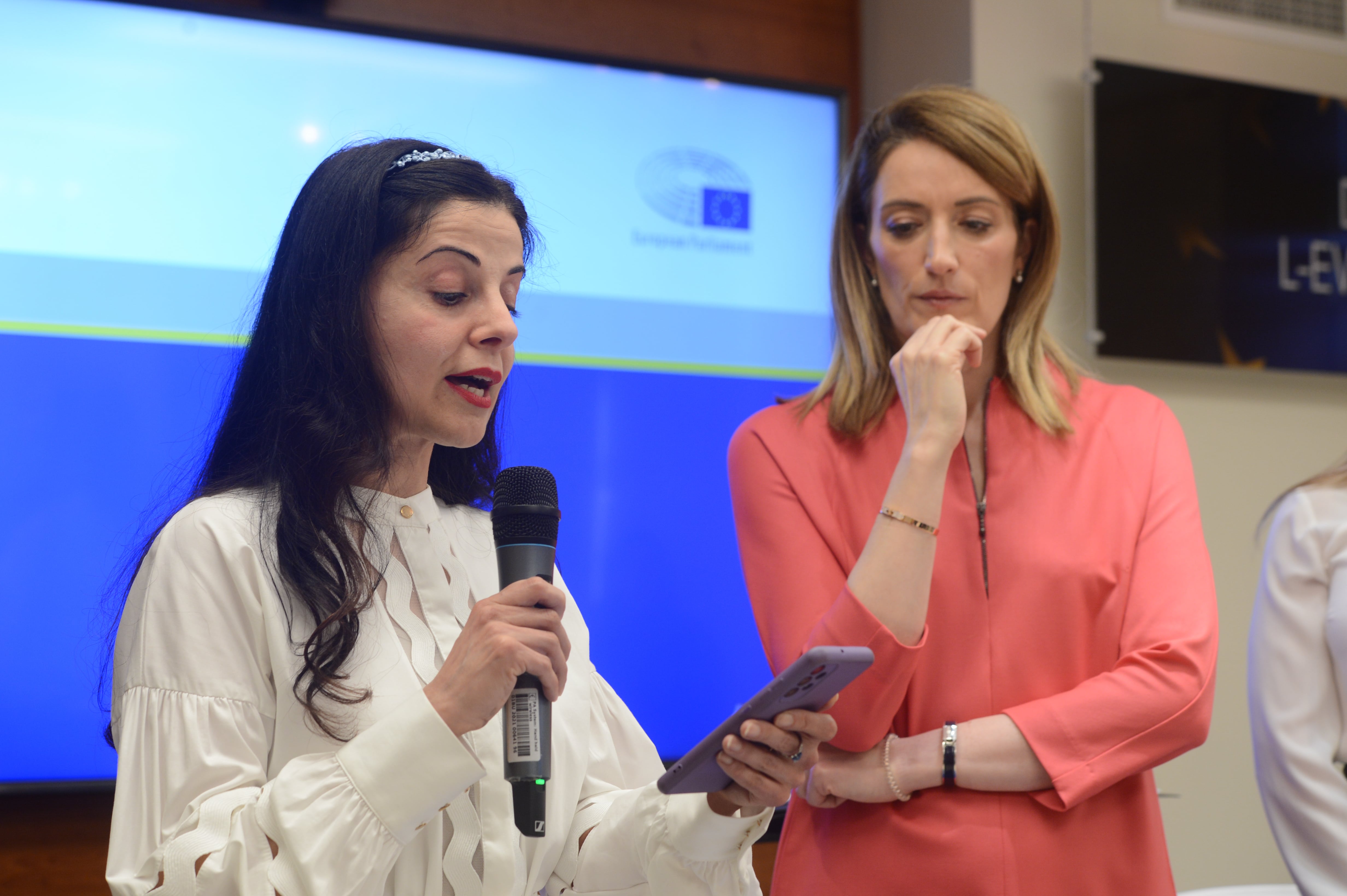 Iranian artist Lida Sherafatmand addressing the audience at the International Women's Day event at Europe House