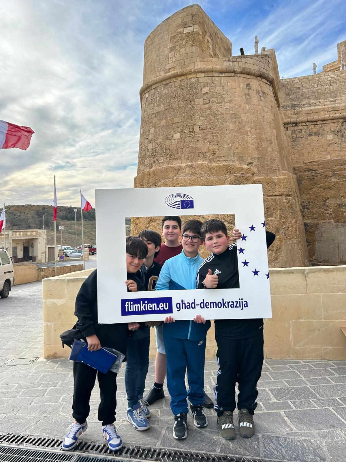 Kids with the #TogetherforDemocracy frame at the 'Lejl Imkebbes' Festival